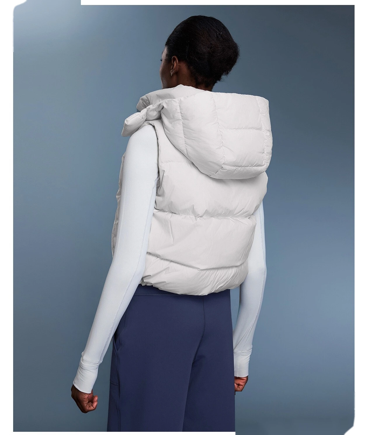 Custom windproof and warm hooded down vest jacket for women in winter. detail